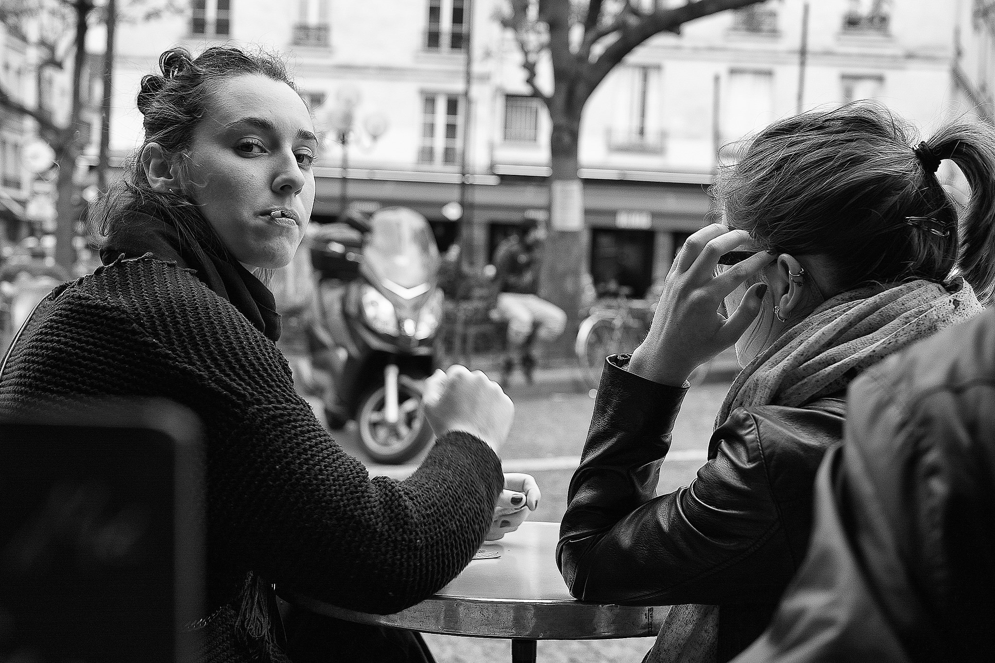 Patrons sitting outside the historic À la Contrescarpe bistro terrace in Paris Latin Quarter