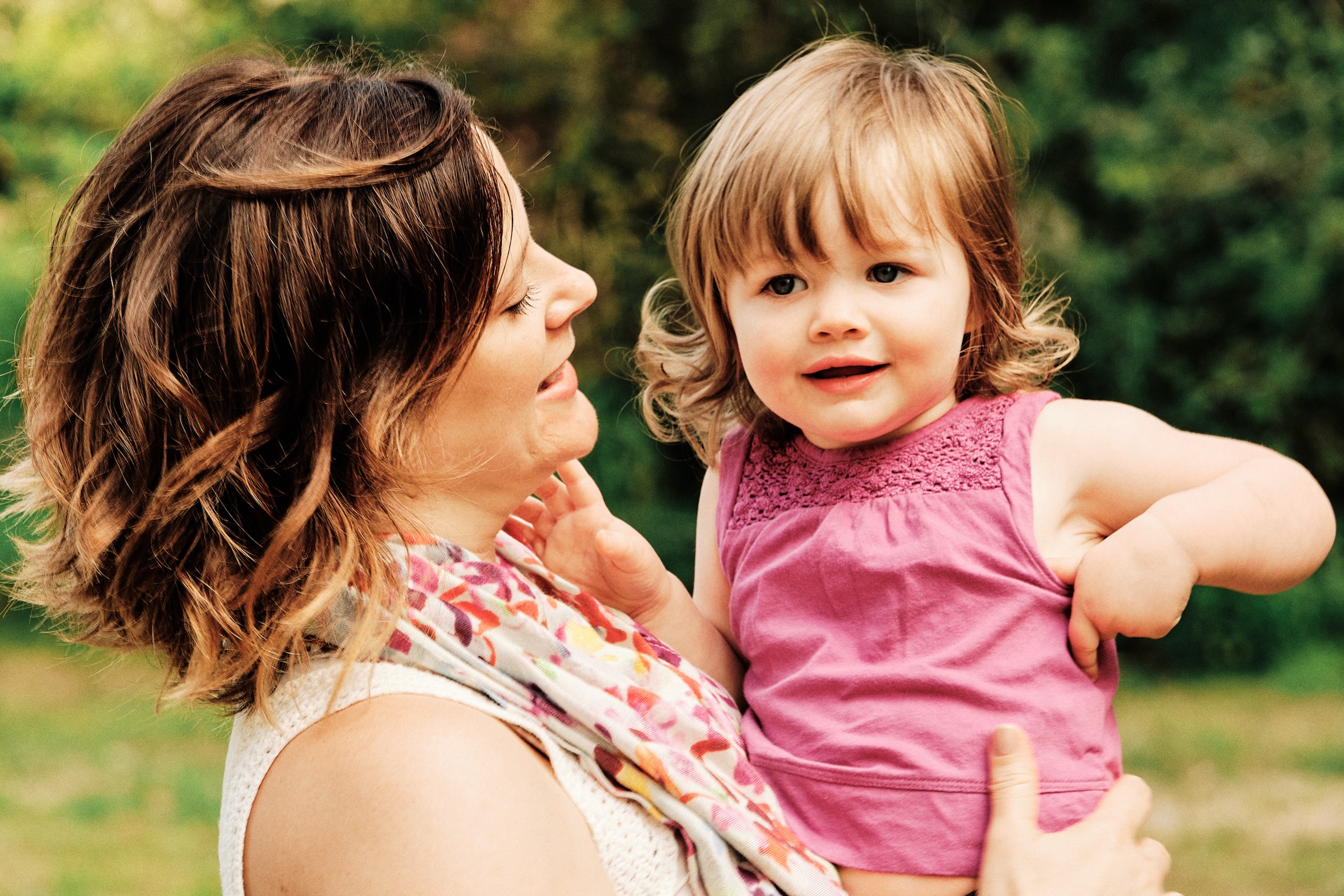 Mother holding her young daughter in natural light in Washougal Washington