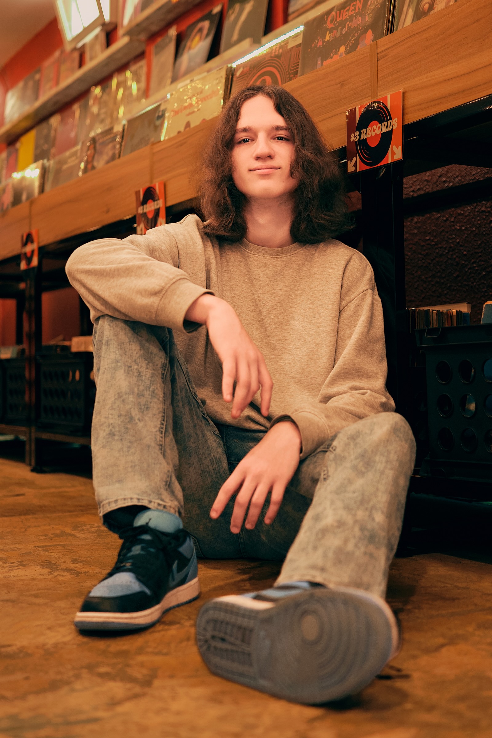 High school senior photographed in a vinyl record store in Vancouver Washington